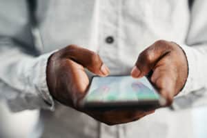 Person looking at FAQs on his mobile device